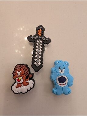 Blue Care Bear, Lion, And Black Pixel Sword Shoe Charms (All 3)